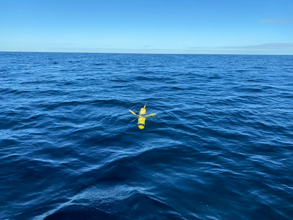 An underwater glider surfaces in the deep blue water of the Mid-Atlantic Bight.
